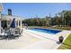 Beautiful backyard with pool, patio, outdoor kitchen and plenty of room for entertaining at 255 Old Town Rd, Dacula, GA 30019