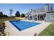 Backyard pool with patio and seating area, perfect for relaxing and entertaining at 255 Old Town Rd, Dacula, GA 30019