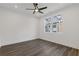 Bright bedroom with dark laminate wood flooring and large window at 1788 Peach Blossom Ne Ln # 45, Atlanta, GA 30324