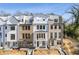 Three story townhome with white and brick exterior at 1788 Peach Blossom Ne Ln # 45, Atlanta, GA 30324