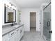 Bathroom featuring gray floors, white walls, white cabinets, a large vanity and a glass shower at 1176 Red Oak Blvd, Loganville, GA 30052