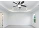 Bedroom features a white ceiling with a fan and recessed lights, white walls, carpet and a window at 1176 Red Oak Blvd, Loganville, GA 30052