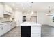 Bright kitchen featuring white cabinets, granite countertops, stainless steel appliances and gray wood floors at 1176 Red Oak Blvd, Loganville, GA 30052