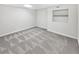 Finished basement with neutral carpet and ample space for recreation or storage at 200 Eagle Glen Ct, Woodstock, GA 30189