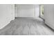 Large bedroom with plush carpeting, multiple windows, and closet space at 200 Eagle Glen Ct, Woodstock, GA 30189