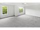 Expansive bedroom offers plush carpeting, multiple windows, and recessed lighting at 200 Eagle Glen Ct, Woodstock, GA 30189