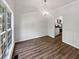 Open dining room boasts stylish chandelier, modern floors, and kitchen access at 200 Eagle Glen Ct, Woodstock, GA 30189