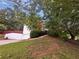 Spacious home featuring attached garage, lush lawn and landscaped curb appeal at 200 Eagle Glen Ct, Woodstock, GA 30189