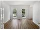 Bright living room offers modern floors and large windows, perfect for entertaining at 200 Eagle Glen Ct, Woodstock, GA 30189