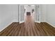 Large living room provides an open floor plan with French doors and modern flooring at 200 Eagle Glen Ct, Woodstock, GA 30189