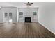 Open-concept living room featuring a fireplace, modern floors, and ample natural light from several windows at 200 Eagle Glen Ct, Woodstock, GA 30189