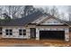 New construction home with a two-car garage and vinyl siding at 112 Scarlett Place Dr, Bowdon, GA 30108