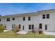 Townhome backyard with green grass and patio at 212 Sanctuary Drive, Mcdonough, GA 30253