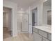 Bathroom featuring glass enclosed shower, double vanity and neutral color palette at 212 Sanctuary Drive, Mcdonough, GA 30253