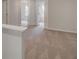Carpeted hallway on the second floor with a view of two rooms with natural light at 212 Sanctuary Drive, Mcdonough, GA 30253