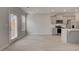 Kitchen featuring stainless steel appliances, gray cabinets, and an open floor plan at 212 Sanctuary Drive, Mcdonough, GA 30253
