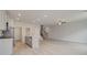Open concept living room with hardwood floors adjacent to kitchen with recessed lighting and ceiling fan at 212 Sanctuary Drive, Mcdonough, GA 30253