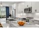 Modern kitchen featuring stainless steel appliances, white cabinetry, stylish countertops, and a central island at 383 Pratt Se Dr # 503, Atlanta, GA 30315