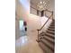 Two-story entryway with marble floors and a grand chandelier at 7155 Roswell Rd # 61, Sandy Springs, GA 30328