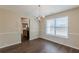 Cozy dining room with wood floors, chandelier, and natural light at 325 Welsh Ct, Fairburn, GA 30213