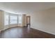 Open living area with wood floors and a sunlit window nook at 325 Welsh Ct, Fairburn, GA 30213