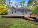 Spacious backyard featuring a wooden deck at 5394 Muirwood Pl, Powder Springs, GA 30127