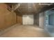 Unfinished basement with concrete floor and light-colored walls at 5394 Muirwood Pl, Powder Springs, GA 30127