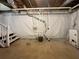 Unfinished basement with stairs, plumbing, and white-sealed walls at 5394 Muirwood Pl, Powder Springs, GA 30127