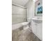 Clean bathroom featuring a vanity with sink and tiled shower with sliding glass doors at 5394 Muirwood Pl, Powder Springs, GA 30127