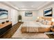 Staged bedroom features contemporary furniture, decor, and hardwood floors at 5394 Muirwood Pl, Powder Springs, GA 30127