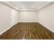 Bedroom boasts hardwood floors and neutral paint at 5394 Muirwood Pl, Powder Springs, GA 30127