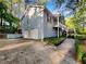 Charming two-story home with a light blue exterior, two-car garage, and inviting entryway amidst lush greenery at 5394 Muirwood Pl, Powder Springs, GA 30127