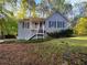 Charming single-Gathering home with a well-maintained lawn and inviting front porch at 5394 Muirwood Pl, Powder Springs, GA 30127