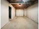 Spacious unfinished garage with concrete floor and white walls at 5394 Muirwood Pl, Powder Springs, GA 30127