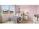 Charming bedroom features a window offering natural light, complemented by a beautiful, decorative design at 130 Oakchase Park Ln, Hampton, GA 30228