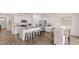 Spacious kitchen flows into the dining area, perfect for entertaining at 130 Oakchase Park Ln, Hampton, GA 30228