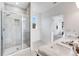 Modern bathroom showcasing a glass shower, double sinks, and neutral tile at 93 Sheryl Way, Loganville, GA 30052