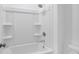 Clean and functional bathroom showcasing a shower-tub combo with white tiling and fixtures at 93 Sheryl Way, Loganville, GA 30052