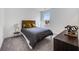This is a cozy bedroom with neutral colors and a window offering natural light, enhancing the calming atmosphere at 93 Sheryl Way, Loganville, GA 30052
