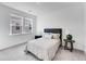 This bedroom features plush gray carpet, a window, and neutral decor, perfect for a peaceful night's sleep at 93 Sheryl Way, Loganville, GA 30052