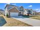 Charming two-story home with brick accents, a two-car garage, and a well-manicured lawn at 93 Sheryl Way, Loganville, GA 30052