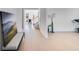 Inviting hallway with hardwood floors leading to a bright and open living space, complemented by stylish decor at 93 Sheryl Way, Loganville, GA 30052