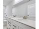 Bright bathroom vanity with double sinks and quartz countertop at 6098 Marigold Way, Atlanta, GA 30349