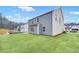 Two-story house with gray siding and backyard at 6098 Marigold Way, Atlanta, GA 30349