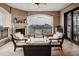 Relaxing covered balcony offers city views, fireplace, tile floors and comfortable seating at 88 W Paces Ferry Nw Rd # 1740, Atlanta, GA 30305