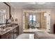 A gorgeous bathroom features a spacious glass shower and granite countertops at 88 W Paces Ferry Nw Rd # 1740, Atlanta, GA 30305