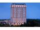 Luxury high rise building at dusk, offering stunning city views at 88 W Paces Ferry Nw Rd # 1740, Atlanta, GA 30305