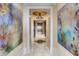 Bright hallway showcasing artwork and access to elevator at 88 W Paces Ferry Nw Rd # 1740, Atlanta, GA 30305