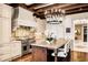 Charming kitchen with stainless steel stove, granite countertops, an island with seating, and custom cabinets at 88 W Paces Ferry Nw Rd # 1740, Atlanta, GA 30305