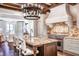Modern kitchen with stainless steel stove, granite countertops, white cabinets and a large island with seating at 88 W Paces Ferry Nw Rd # 1740, Atlanta, GA 30305